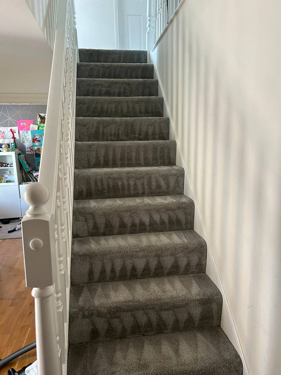 Carpeted staircase landing after a professional clean